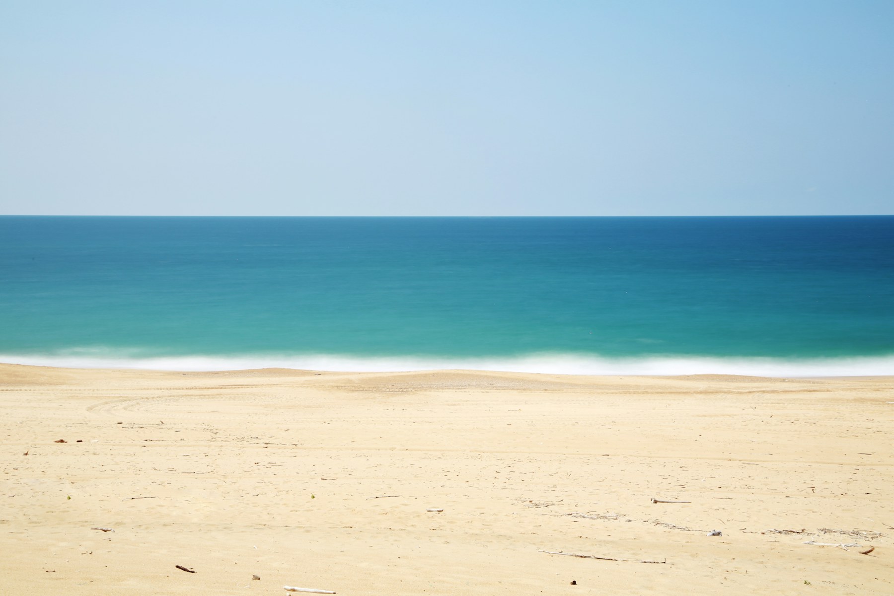 A quiet shoreline with turquoise water